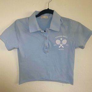 Cropped, light blue, collared shirt with ‘Tennis Ball’ design